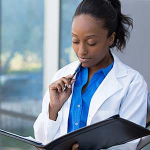 ams-doctor-with-book-x300